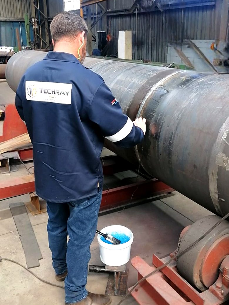 TechRay NDT technician carrying out ultrasonic testing on a large fabricated pipe section
