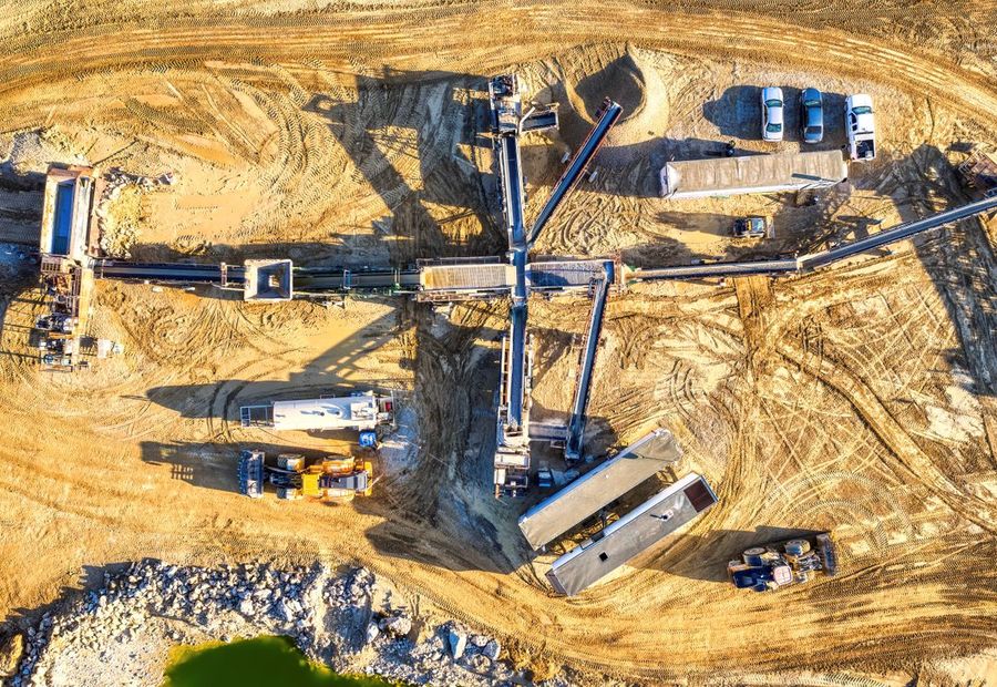 Aerial view of a mining operation with conveyors and processing plant
