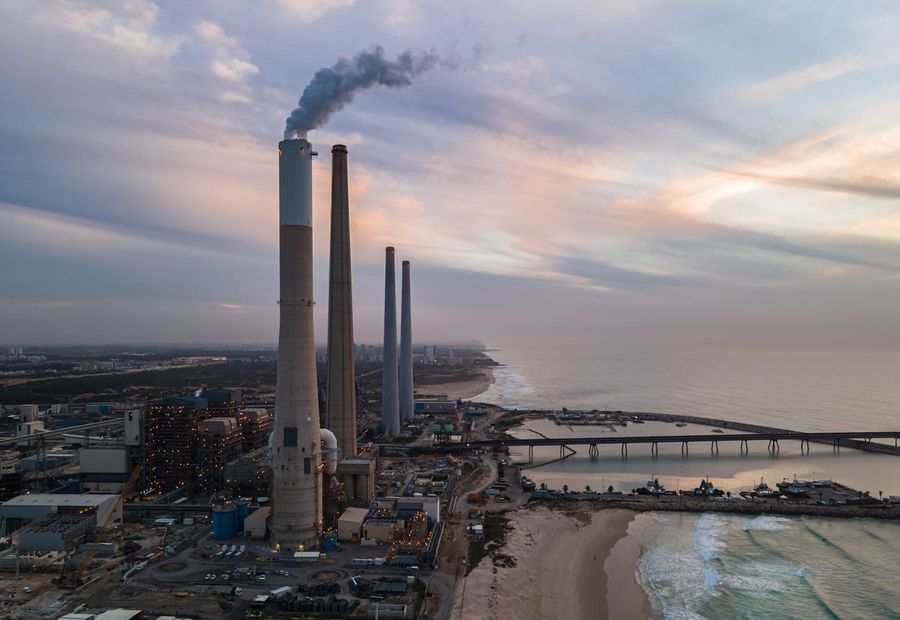 Power station with tall chimney stacks